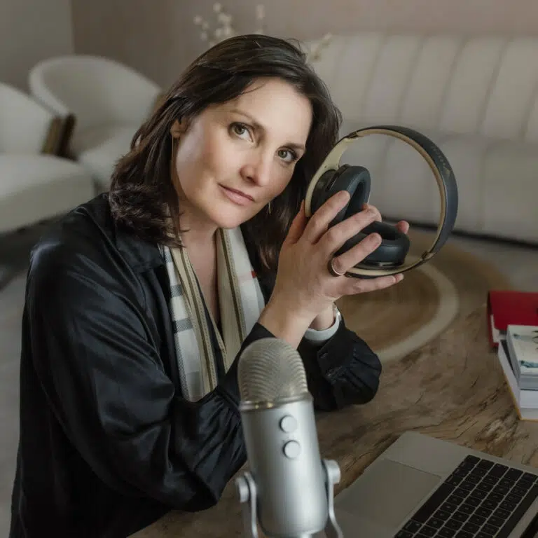 Fiona Elizabeth profile image - holding headphones, sitting in front of mic