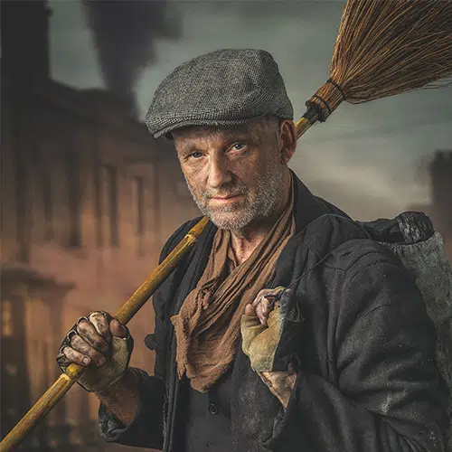 Peter Rooney headshot - styled as a chimney sweep